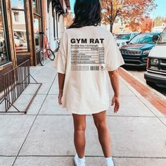 "Introducing our \"Gym Rat Nutrition Fact'' shirt--a funny and stylish addition to your gym wardrobe.This hoodie is packed with humor, featuring a playful \"nutrition label\" that proudly declares some gymrats characteristics. HOW TO ORDER: 1. Choose size/color options 2. Select the quantity 3. Click \"Add to Cart\" 4. Proceed to payment COMFORT COLOR SHIRT FEATURES - 100% ring-spun cotton - Medium fabric - Many range of colors available - Relaxed fit - sewn-in twill label SIZING: While these T shirts are unisex and run true to size, we would recommend sizing up 1-2 sizes for an oversized look! CARE INSTRUCTIONS: - Machine wash cold, inside out - Hang dry or tumble dry low - Do not bleach or iron directly on design PROCESSING AND SHIPPING: 3-5 business days for processing Allow 5-7 busines Mas Outfits, Gym Pump Cover, Gym Pump, Funny Gym Shirt, Gym Bro, Gym Wardrobe, Nutrition Label, Muscle Mommy, Funny Gym Shirts