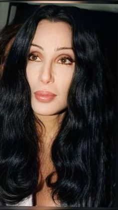 a woman with long black hair and brown eyes