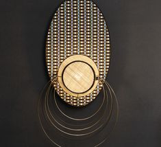 a wooden plate sitting on top of a black table next to a metal wire rack