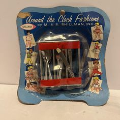 a set of four stainless steel utensils in a plastic package with an advertisement for around the clock fashions