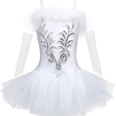 a white tutu dress with silver sequins and feathers