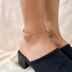 Stainless steel chain anklet featuring bright orange beads ❀❀ INFO: ❀❀ * Handmade in Southern California ♡ * Stainless steel, tarnish resistant material * 1.5" extender chain for an adjustable fit * Gorgeous bright orange beads ❀❀ MODEL SIZE REFERENCE: ❀❀ Measurement above ankle bone: 7.75" Measurement at ankle bone: 8" Wearing an 8.5" length anklet ❀❀ SHIPPING & PROCESSING: ❀❀ Anklets are MADE TO ORDER Please see "Shipping and returns policy" on this page for the latest processing times and estimated delivery dates. Estimated shipping is also shown in your shopping cart. Thank you!♡ Orange Beaded Chain Bracelet As A Gift, Adjustable Orange Beaded Chain Bracelets, Orange Beaded Bracelets, Elegant Orange Beaded Chain, Adjustable Gold Beads Anklets, Adjustable Orange Anklets For Beach, Gold Metal Anklet With Adjustable Chain, Adjustable Nickel-free Orange Bracelet, Ankle Bones