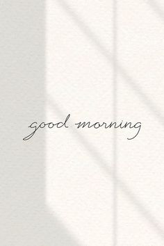 the word good morning written in black ink on a white wall