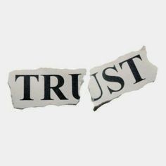 two torn pieces of paper with the words trust and trust written on them, against a white background