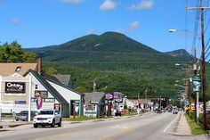 a small town with mountains in the background