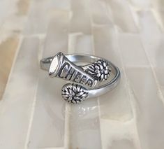 "Cheerleader's \"cheer\" megaphone ring is a perfect cheer jewelry gift for your favorite cheerleader to dance, cheer and shout! Sterling silver ring features an adjustable band with pom poms and \"cheer\" megaphone. One size fits most (5 - 8). When resizing the ring, do not put pressure on the top of the ring. Gently, size the ring to your finger, so you can slip the ring on and off without reopening the ring at the top. ------------------------------------------------------------- - Add GIFT W Cheer Tricks, Cheer Vibes, Cheer Team Gift, Cheer Jewelry, James Avery Bracelet, Cheer Tryouts, Cheer Posters, Cheer Team Gifts, Cheer Megaphone