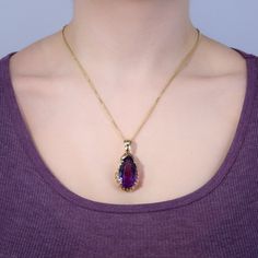 This magnificent amethyst enhancer pendant features a 36.50ct pear cut amethyst and is crafted of heavy scrolling and pierced 14k yellow gold. We have added a 22 inch long 14k yellow gold rounded box chain weighing approximately 3 grams. Elegant Purple Jewelry With Large Pendant, Luxury Purple Teardrop Jewelry, Luxury Purple Pear-shaped Jewelry, Elegant Purple Teardrop Pendant Jewelry, Elegant Purple Pear-shaped Necklace, Yellow Gold Amethyst Teardrop Pendant Jewelry, Purple Teardrop Pendant Necklace For Formal Occasions, Brand Presentation, Old Boxes