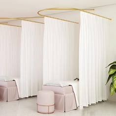 a room with white drapes and pink stools in front of a potted plant