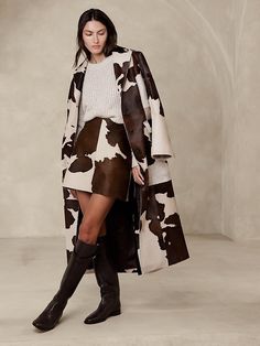 Saw this on Banana Republic: Western Luxury Fashion, Cow Print Clothing, Luxury Western Outfit, Western High Fashion, Cow Print Outfit Ideas, Cow Print Fashion, Leather Skirt With Boots, Winter Western Outfits, Cowgirl Lifestyle