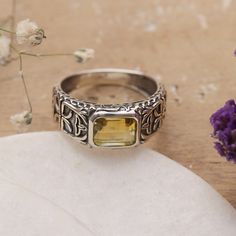 Parul of India presents a victorious men's single-stone ring. A faceted rectangle of citrine is set in a wide sterling silver band ornamented with gallant details. Oxidation is artfully applied to bring out the intriguing abstract motifs, transforming the piece into a dapper element. Abstract Motifs, Ring Inspo, Single Stone Ring, Citrine Ring, Single Stone, Sterling Silver Bands, Stone Ring, Silver Band, Stone Rings