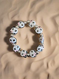 Description Add some playful charm to your look with this Enamel Metal Panda beaded Stretch bracelet. Featuring a stretchy design and a cute Panda face with an enamel finish, this bracelet brings a touch of whimsy to any outfit. Perfect for animal lovers and fashion enthusiasts alike! Details Length: 7" Black, pink and white enamel with rhodium colored metal 11mm x 14mm bead size 10 beads Panda face shape with enamel finish Nickel free Enamel and zinc alloy Features One of a kind, fashion jewelr Panda Face, Creative Memories Scrapbooking, Creative Memories, Cute Panda, Beaded Stretch Bracelet, Face Shape, White Enamel, Animal Lovers, Stretch Bracelet