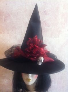 New this season! Scarlet or garnet red organza on this black satin hat with black tulle. Skull is optional. You can order the hat with or without. Just state your preference in the buyer notes! If no preference is stated it will not be added. Fits up to 22.75 inches head circumference. Black Top Hat For Halloween, Halloween Costume Hat Accessories, Adjustable Red Mini Hat For Halloween, Fitted Themed Mini Hats For Halloween, Themed Fitted Mini Hats For Halloween, Fitted Red Halloween Hat, Witchy Black Top Hat For Halloween, Halloween Costume Hat, Black Mini Hats For Halloween Themed Events