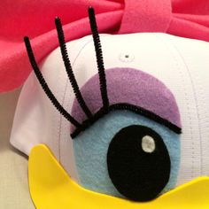 a close up of a hat with an eye on it