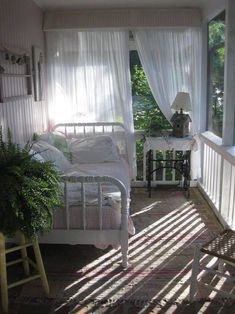 the sun is shining through the sheer curtains in this bedroom with white bedding and pillows