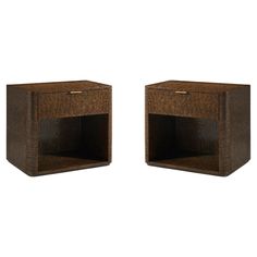 a pair of wooden nightstands with one drawer open and the other closed on both sides