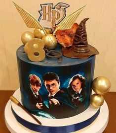 a harry potter birthday cake with gold decorations