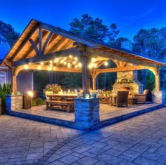 an outdoor covered patio with lights on it