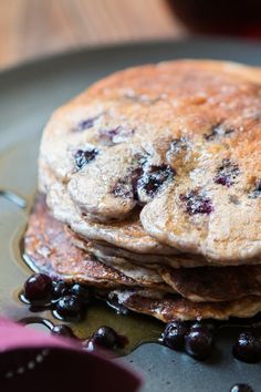 pancakes with blueberries and syrup on a plate