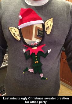 a man wearing a christmas sweater with an elf on it