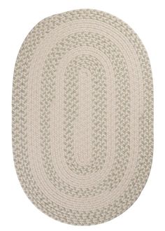 the oval rug is shown in beige and white