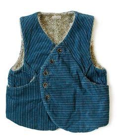 a blue vest with buttons on the back and a fur lined lining around the waist