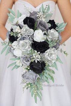 a bridal holding a black and white bouquet