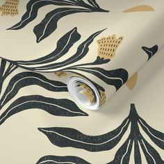 an artistic wallpaper with gold and black leaves on white background, including a roll of tape