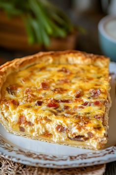 a piece of quiche sitting on top of a white plate