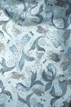 a blue and white fabric with fish on it