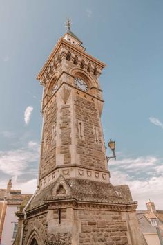 a tall tower with a clock on it's side