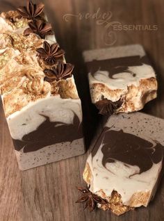 three brown and white soaps on a wooden table with cinnamon sprinkles