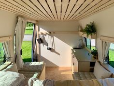 the inside of a camper with lots of windows