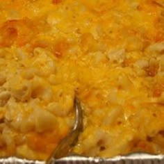 a casserole dish with macaroni and cheese on it, ready to be eaten