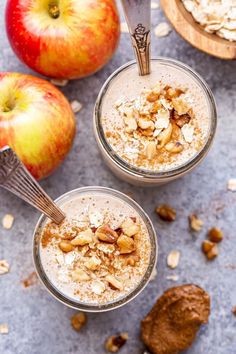 two glasses filled with oatmeal and apples