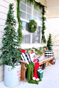 the front porch is decorated with christmas decorations