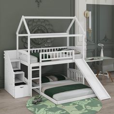 there is a white bunk bed with a slide on the bottom and stairs to the top