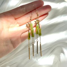 👂PRODUCT DETAILS Bamboo Dangle Earrings by ELEVEN11DREAM - Material: 14k gold plated + Natural Jade - Size: Length 3.54in. /Drop Length 2.95 in. /width0.4in.     Length 9cm /Drop Length 7.5cm /width1cm - Sold in pairs 🎈SHIPPING - All orders will be shipped within 1-3 business days after the order has been received - Ship all orders via USPS First-Class Mail - FREE SHIPPING for all USA domestic orders 💖PLEASE READ THE PRODUCT DESCRIPTION - All products are made by my hand with love and care in my studio - All products are nicely packaged in a protected clear box or bag to avoid damage - Keep your jewelry away from water or any liquid chemicals to avoid discoloration (for example, swimming or bathing) - Safely store your jewelry in a jewelry box or airlock bag 🔴RETURNS, REFUNDS&EXCHANGES Plant Earrings, Bamboo Leaf, Bamboo Plant, Jade Earrings, Natural Jade, Zen Garden, Leaf Earrings, First Class, Jewelry Pieces