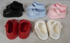 several pairs of baby shoes are lined up on the floor next to eachother