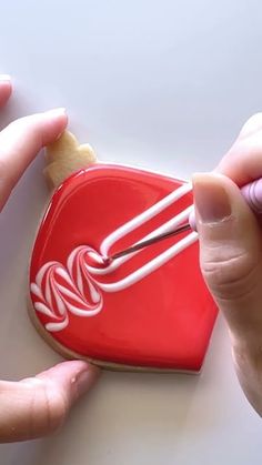 Christmas Ornament Cookie Decorating | Satisfying Cookie Decorating with royal icing Royal Icing Chocolate Chip Cookies, Holly Decorated Cookies, Ornament Cookie Decorating Ideas, Cookie Decorations Christmas, Christmas Cookie Frosting Ideas, The Best Royal Icing For Sugar Cookies, How To Decorate Sugar Cookies Christmas, Winter Cookie Decorating Ideas, Cute Xmas Cookies