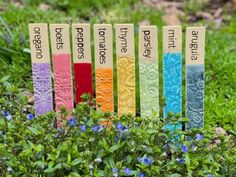 Custom vegetable and herb garden markers are perfect for anyone's gardenThese durable garden stakes are high fired to withstand the elements and help organize your garden for years to comeEach custom marker is hand painted with large lettering to maximize readability from a distanceApproximately 9long x 1wide x .25thick Size and colors will vary as each piece is individually handmadeThe back of each marker is unglazedAll our pottery is non-toxic and high fired to cone 6 and c Herb Garden Markers, Herb Markers, Plant Puns, Garden Tags, Rainbow Garden, Garden Labels, Ceramic Garden, Plant Tags