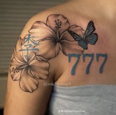 a woman with a butterfly and flower tattoo on her shoulder, showing the number 777