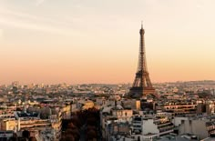 the eiffel tower towering over the city of paris, france at sunset or dawn