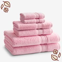 six pink towels stacked on top of each other in front of a white background,