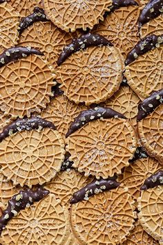 some cookies with chocolate and sprinkles on them