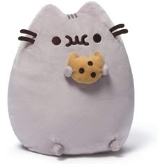 a small stuffed animal with a cat on it's back and eyes closed, sitting in front of a white background