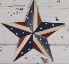 a red, white and blue star hanging on a wall