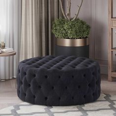 a round ottoman with buttons on it in front of a window and a potted plant