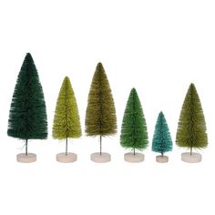 five small trees in different colors and sizes