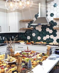 a kitchen filled with lots of food on top of a counter