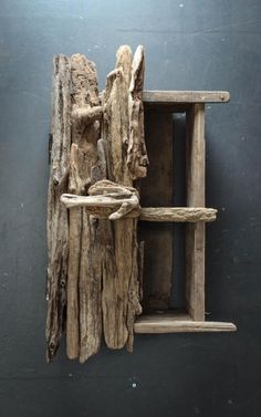 a piece of driftwood is hanging on the wall